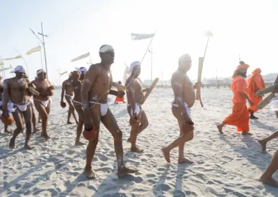 A group of Hindu sadhus were returning to their akharas after completing the "Pind Dan" ritual, a funeral ceremony performed to pay homage to their ancestors for the salvation of their souls, following a purifying bath in the river.